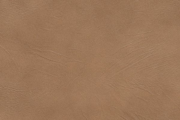 Close-up of Genova Fawn’s textured brown leather surface, showing natural creases, fine lines, and subtle tonal variations typical of genuine leather.