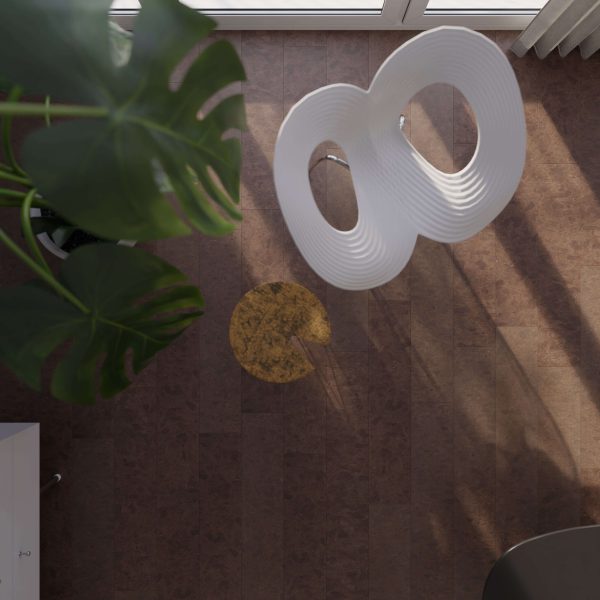 Overhead view of a modern room featuring the Vintage Shoreline white sculptural chair, brown floor, large green plant, sunlight casting shadows, and a round yellow mark on the floor.