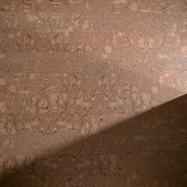 Burl Natural features a textured brown cork surface with a diagonal shadow across the lower right corner, highlighting the contrast between lit and shaded areas.