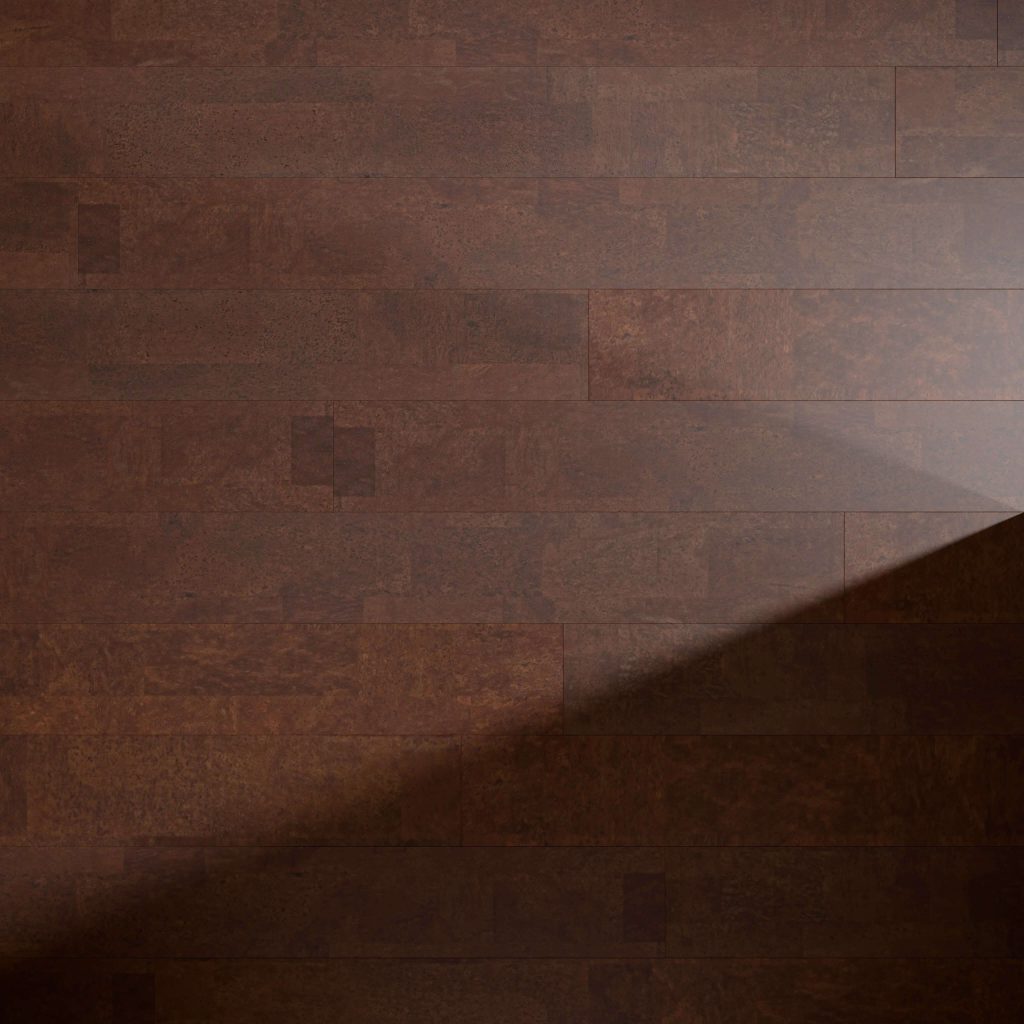 Boulevard Jasper flooring features rich brown wood panels with a diagonal beam of light forming a bright triangular spot that highlights the grain and texture, while the rest of the floor remains in shadow.