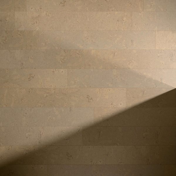 Burl Chai beige stone wall features horizontal rectangular tiles with subtle textured patterns and natural color variations, partially shaded diagonally across the lower right corner.