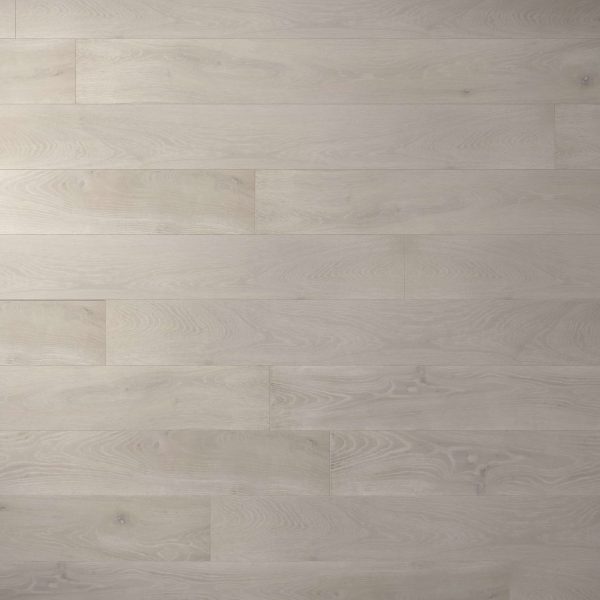 Fairwinds Oak* features light gray wide planks with subtle wood grain patterns and a smooth matte finish. Planks are installed horizontally, creating a clean, modern look.