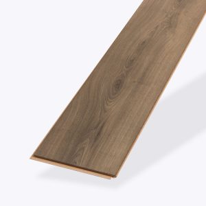 A single, rectangular piece of Warm Brown Oak laminate flooring featuring a smooth finish and visible grain pattern, isolated on a light gray background.