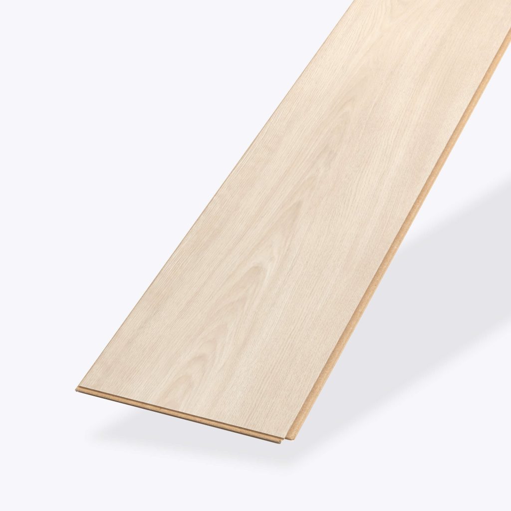 A single Galena Oak light wood-colored laminate flooring plank viewed from an angle on a plain white background.