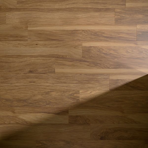 Johnson* hardwood flooring features a natural grain pattern in medium brown. Sunlight casts a diagonal shadow on the lower right corner, accentuating the texture and variation of the wood planks.