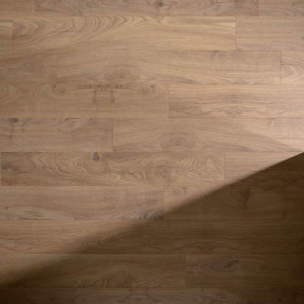 Louise* light brown wooden floor features visible grain patterns and floorboards arranged in a staggered pattern, with a diagonal shadow in the bottom right corner.