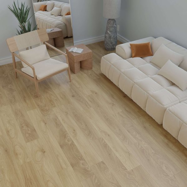 The Minnewanka living room features light wood flooring, a beige tufted sofa with white and orange cushions, a minimalist wooden chair, two small wood side tables, a floor lamp, a plant, and a large mirror against a white wall.