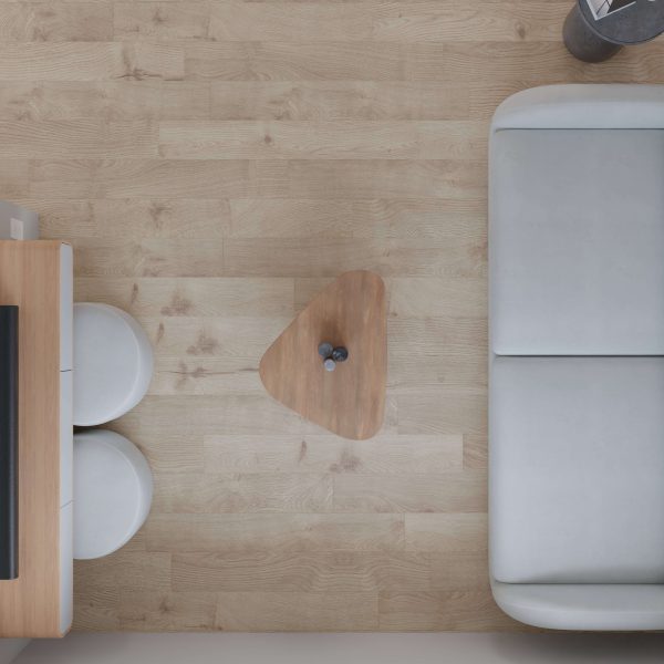 Top-down view of a minimalist living room featuring Alberta: light wood flooring, a small triangular wooden coffee table with two vases, a light gray sofa, and a wooden desk paired with two round white stools.