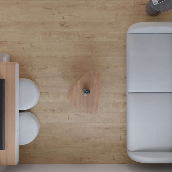 A top-down view of a modern living space featuring Cavell—a light wooden floor, gray couch, small triangular coffee table with two items, and two round white stools by a wooden desk.
