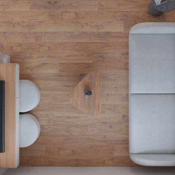 A top view of a minimalist living space with the Woolley* light gray sofa, a small triangular wooden coffee table holding two decorative items, two round white stools, and wooden flooring.