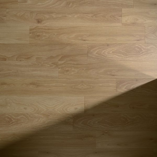 The Pyramid floor features a light brown wood finish with a subtle grain pattern. Smooth and well-maintained, it is partially covered by a diagonal shadow in the lower right corner, highlighting its quality craftsmanship.