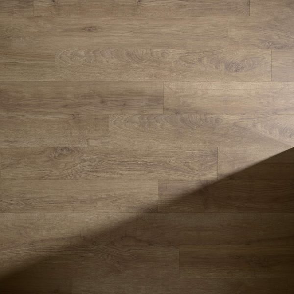 Lowell light brown wooden floor with natural grain pattern, partially covered by a diagonal shadow extending from the lower right corner to the center.