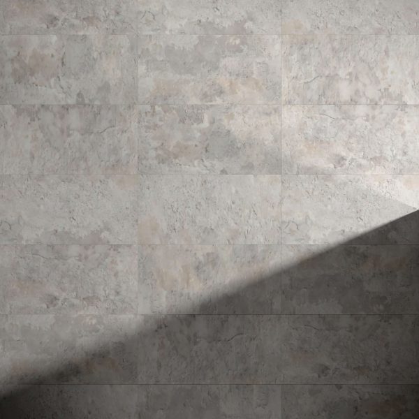 A wall of Bridgewater gray textured tiles, with a diagonal shadow cast across the lower right corner, creates a striking contrast between illuminated and shaded areas.