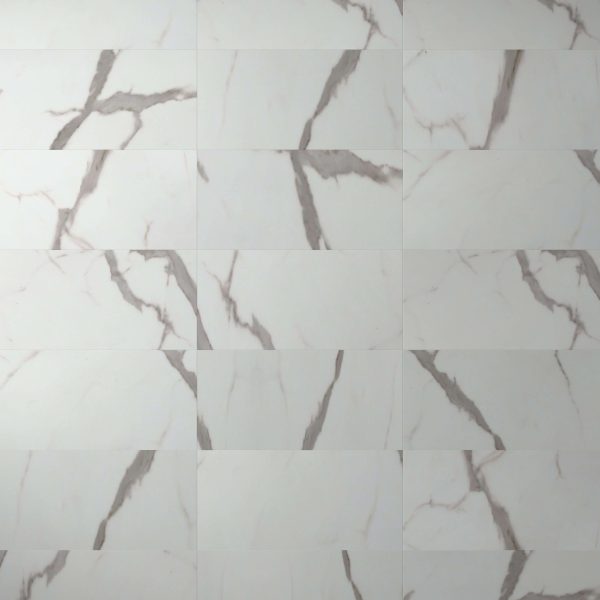A wall of Calcatta* rectangular white marble tiles with glossy finish and gray veining, arranged in a staggered pattern. Each tile features unique natural vein patterns.