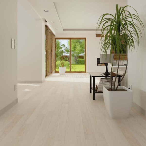 Oyster Bay: A bright, modern living room with light wood floors, large windows overlooking a green garden, indoor plants in white pots, and a sleek black table featuring a computer and books.