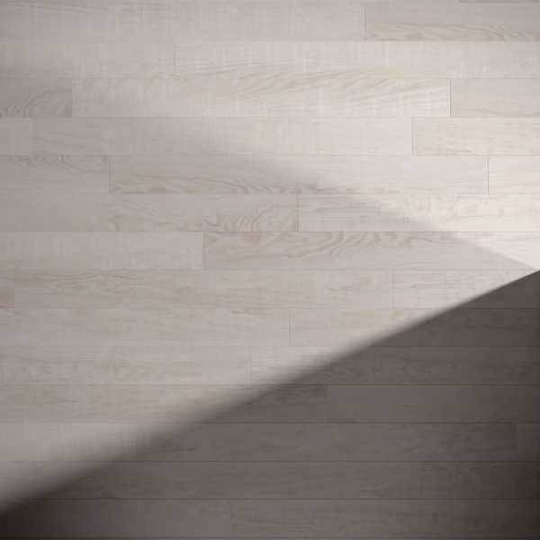 Oyster Bay light-colored wooden floorboards with visible wood grain and texture, featuring a diagonal shadow that creates contrast between illuminated and shaded areas.