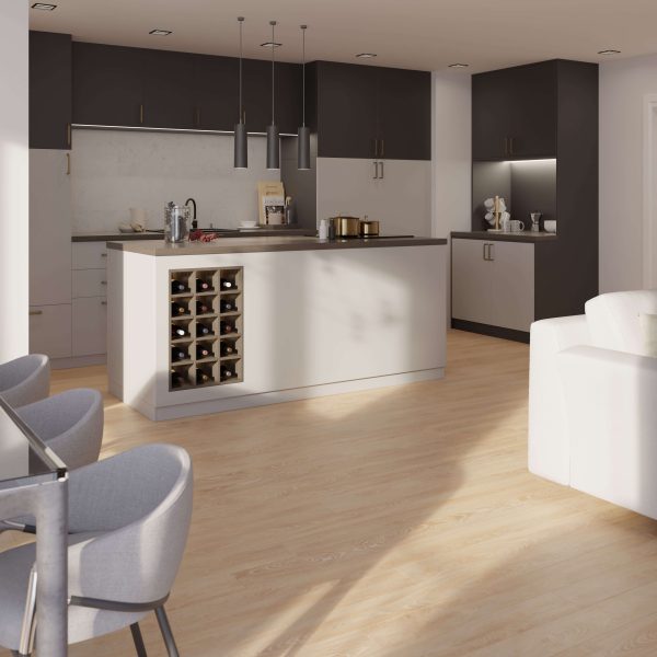 The modern kitchen features Shelbourne cabinets—dark uppers and light lowers—light wood flooring, a central island with built-in wine rack, pendant lights, gray bar stools by a glass table, and a glimpse of a white sofa.