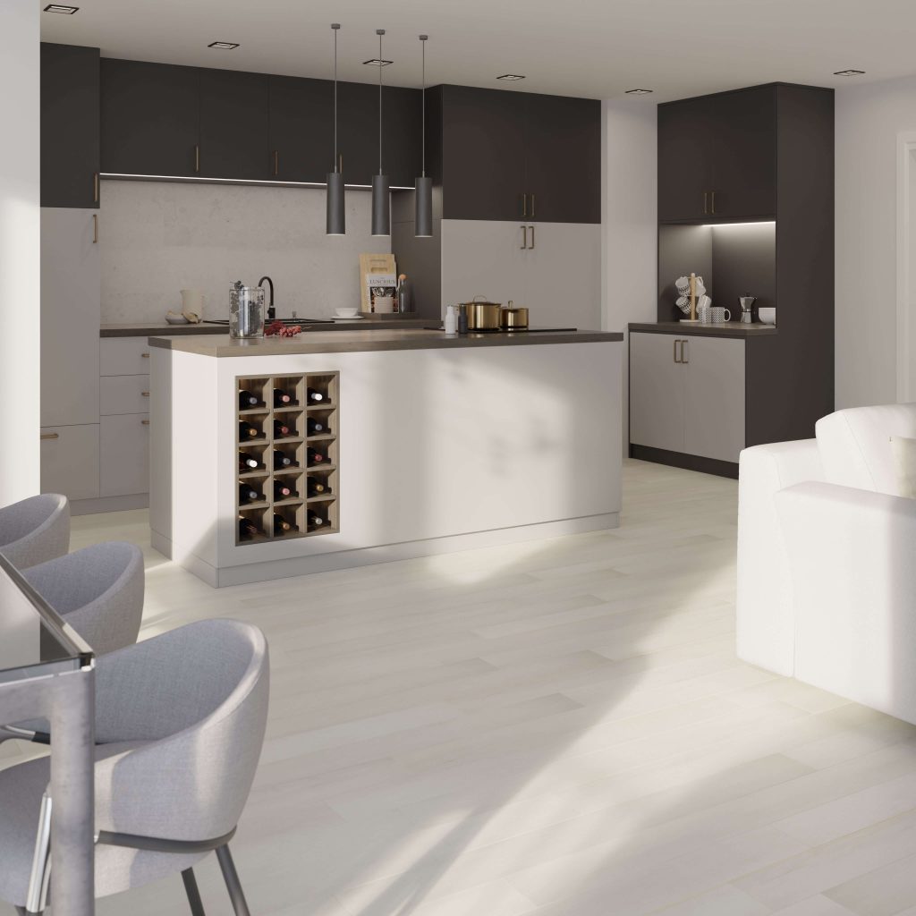 The Glenbrook* kitchen showcases a large island with built-in wine storage, sleek dark cabinets, stainless steel appliances, pendant lights, and light wood floors; gray chairs and a white sofa complete the modern look.