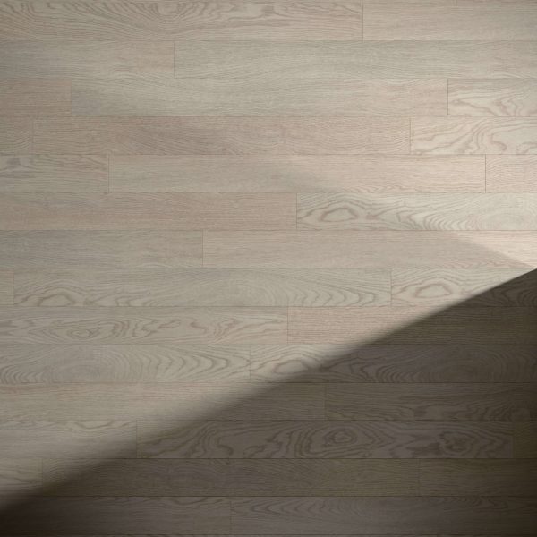 Hillston* features light-colored wooden floorboards with subtle wood grain patterns. A diagonal shadow in the lower right corner contrasts the illuminated and shaded areas of the floor.
