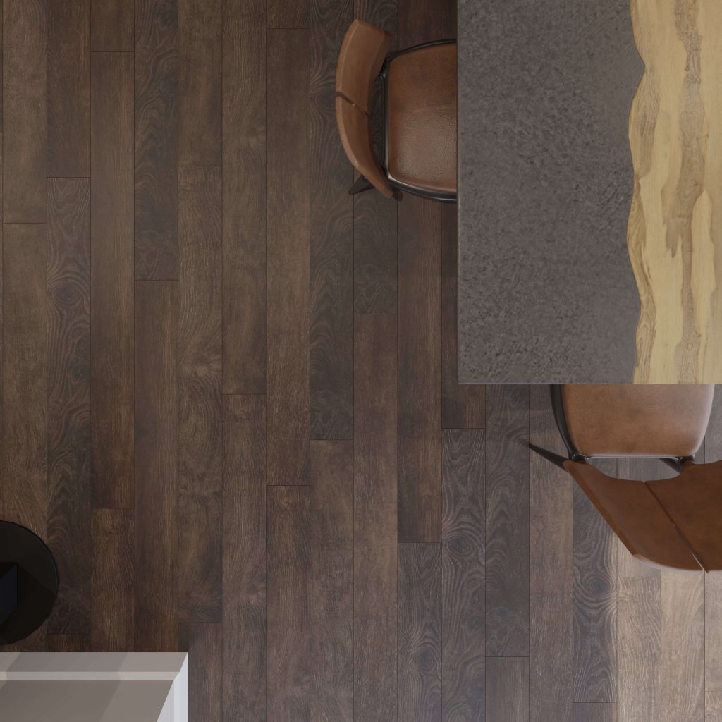 Top view of two brown chairs at a table with a gray and wood grain surface—the Blackrock—set on dark wood flooring. A white object and a black circular object are partially visible in the lower corners.