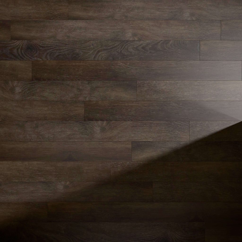 A shadow falls diagonally across the Blackrock dark wooden floor, showcasing its visible grain patterns, subtle sheen, and rich brown tones while the illuminated planks highlight the floor’s natural texture.