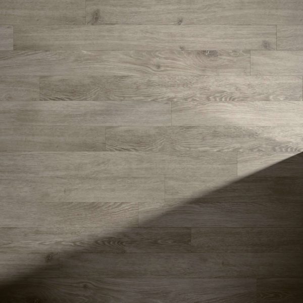 Waverley light brown wood floor with visible grain and planks, partially shaded by a diagonal shadow in the lower right corner.