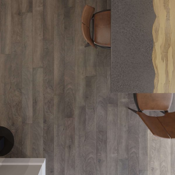 Top-down view of the Valley Springs wooden floor with two brown chairs beside a table featuring a gray surface and natural wood accent edging. A white object is partially visible in the lower left corner.