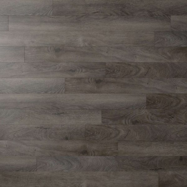 Valley Springs features dark gray wood laminate flooring with a textured grain pattern. The horizontal planks highlight natural wood knots and swirls, creating a realistic look.