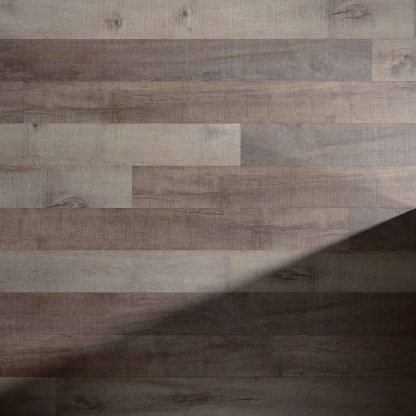 Seabright* features wide wooden planks in mixed brown and gray tones, arranged in a staggered pattern. A diagonal shadow crosses the floor from the bottom right corner.