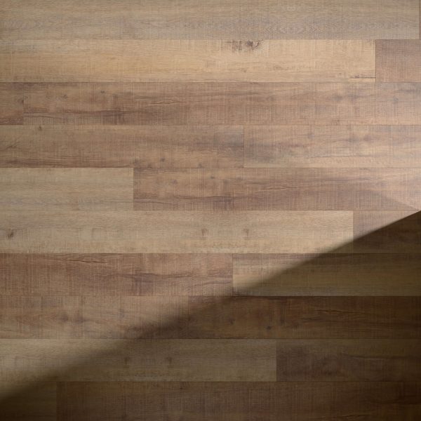 Rockland* light brown wooden floorboards arranged in a staggered pattern, with a diagonal shadow cast across the lower right corner of the image.