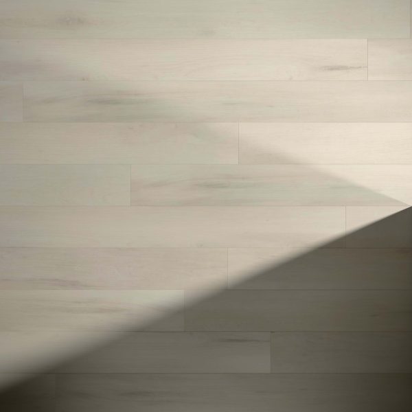 Clermont features a light-colored wooden floor with horizontal planks. A large triangular shadow in the lower right corner creates contrast against the otherwise evenly lit surface.