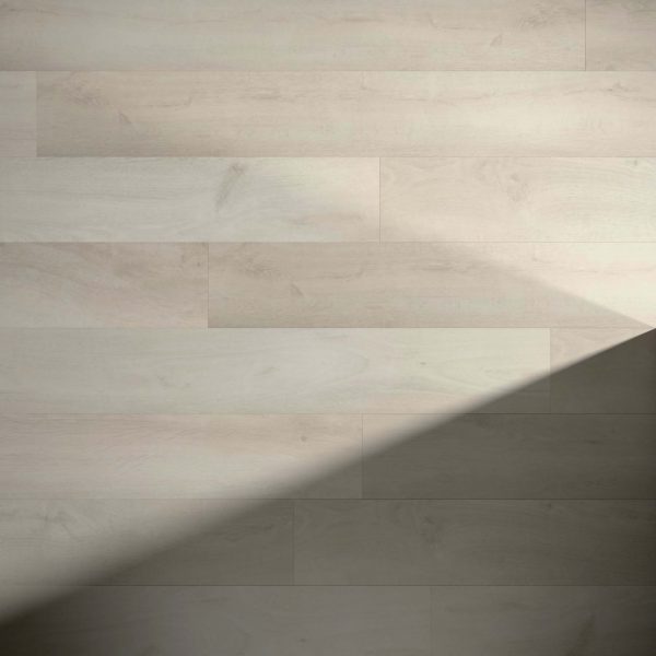 Atherton* light wood flooring features a subtle grain pattern, enhanced by natural light. A diagonal shadow in the lower right corner adds contrast between illuminated and shaded areas.