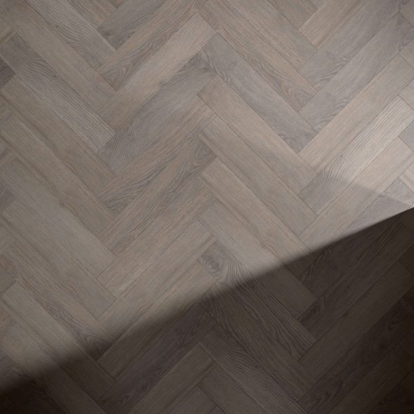 Sandy Ridge wooden floor in a herringbone pattern, with a soft, angled shadow falling across the bottom right corner.