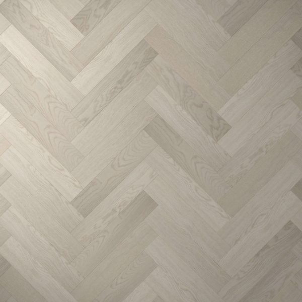 Wentworth* features light-colored wooden flooring in a herringbone pattern, showcasing subtle wood grain on each plank. Its neutral tone creates a modern, clean look.