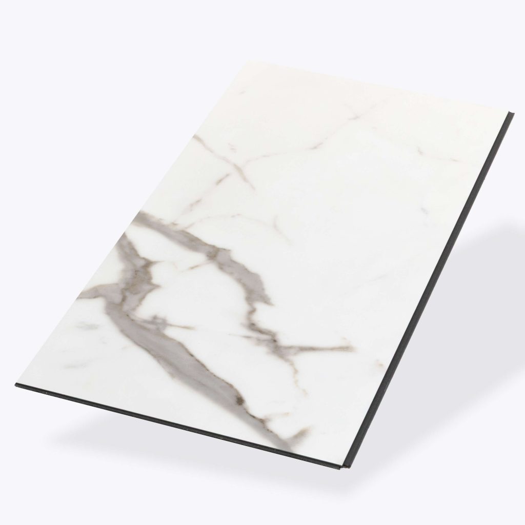 A rectangular slab of Calcatta* marble with gray veining, displayed at an angle on a plain, light background.