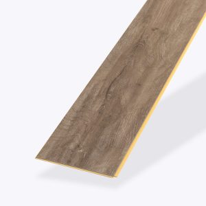A single Brighton Hill rectangular plank of wood-look vinyl flooring features a brown, textured grain pattern and yellow edges, displayed on a light background.