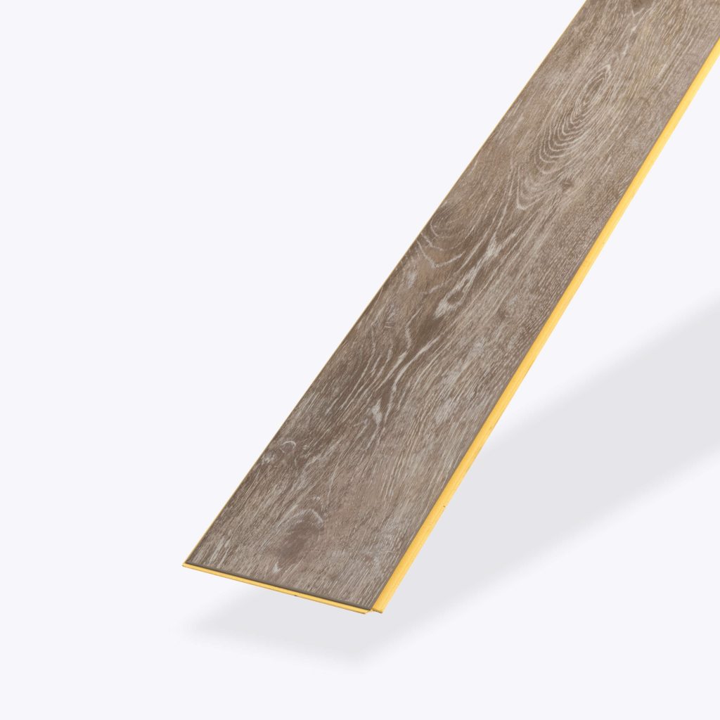 A single, elongated Beach House* vinyl flooring plank features a grayish-brown wood-look finish with subtle grain patterns, beveled edges, and a yellow underside, displayed on a white background.