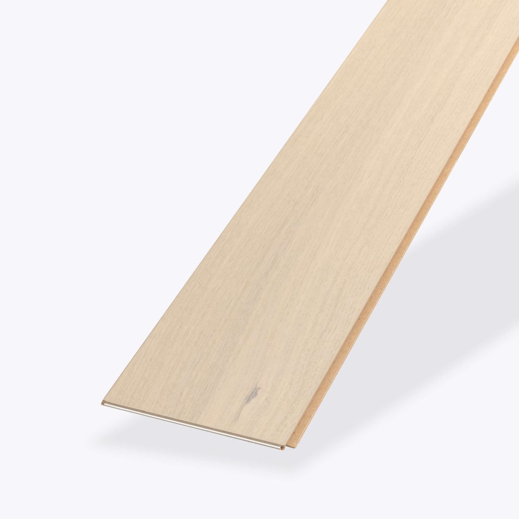 A long, narrow Crema Rustic Oak plank with a light wood tone and smooth surface is displayed at an angle against a plain white background.