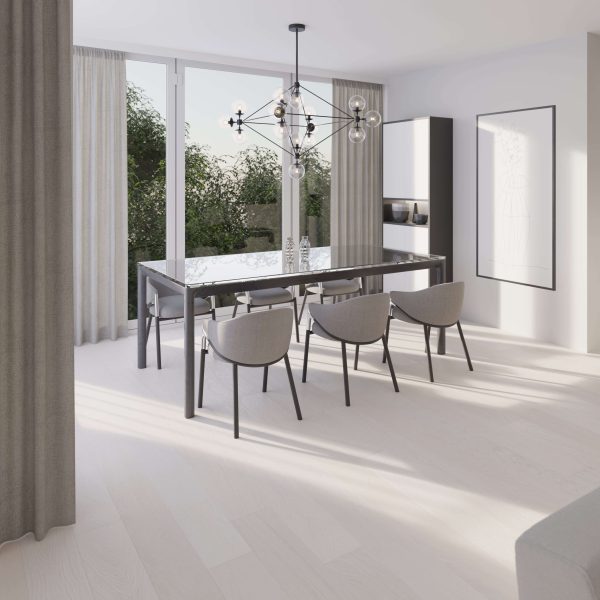 A modern dining room features a glass table, six grey chairs, large windows with beige curtains, a geometric chandelier, Winter Hill Oak* flooring, and greenery outside. Minimalist decor complements the natural light-filled space.