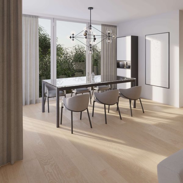 Modern dining room with a glass table, six gray chairs, black exposed-bulb chandelier, large windows with sheer curtains, Basin Oak* light wood flooring, minimalist decor, and greenery visible outside.