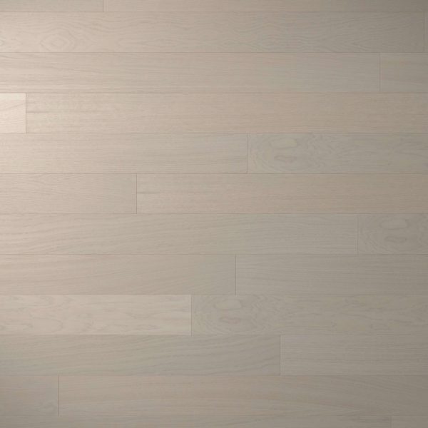 Everglade Oak features wide, smooth planks in a light wood tone with subtle grain and a matte finish. The staggered layout provides a clean, modern look to any space.