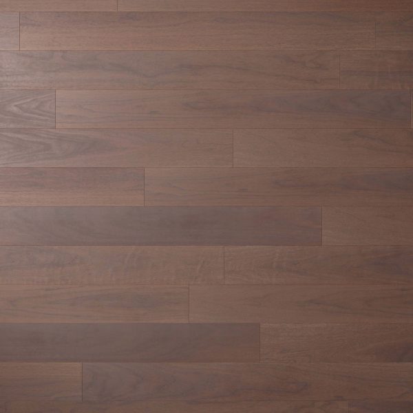 A close-up of Harvest Walnut* floorboards shows reddish-brown wood arranged horizontally, highlighting natural grain and subtle color variations.