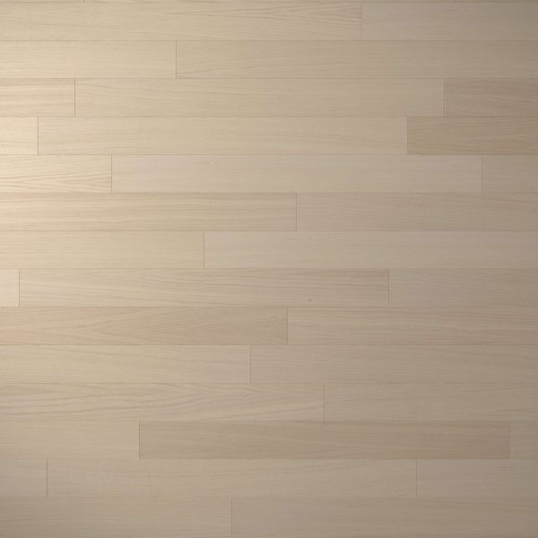 White Oak Natural* features a light-colored, smooth wooden floor with a horizontal plank pattern and subtle variations in grain and shade across the surface.
