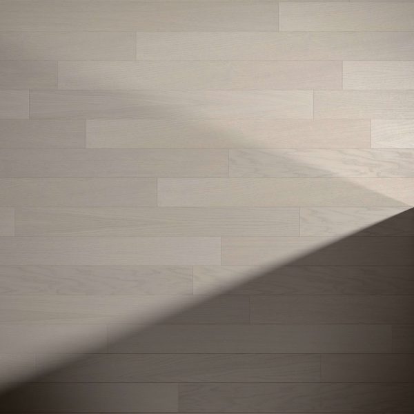 Braeburn Oak* light gray wooden floorboards with a diagonal shadow across the bottom right, highlighting a contrast between illuminated and shaded areas.