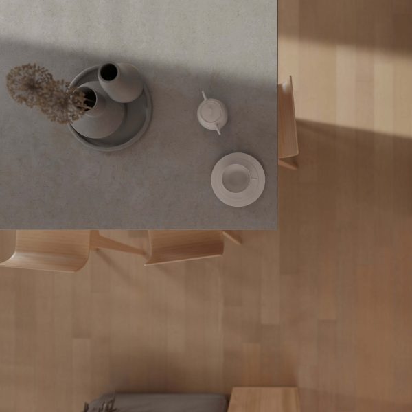 A minimalistic tabletop with ceramic vases, dried flowers, a teapot, and teacup sits beside light wooden chairs on a Kamee Oak* floor, all bathed in soft natural light.