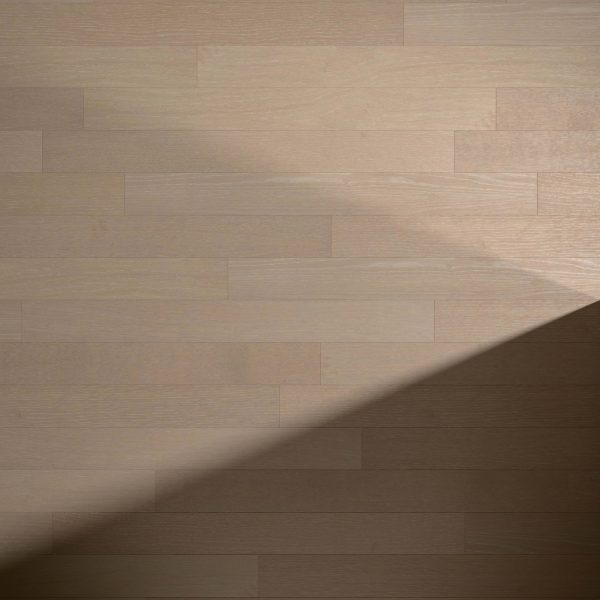Kamee Oak* light wood floor features a diagonal shadow from the bottom left to the upper right, creating a striking contrast between bright and shaded areas.
