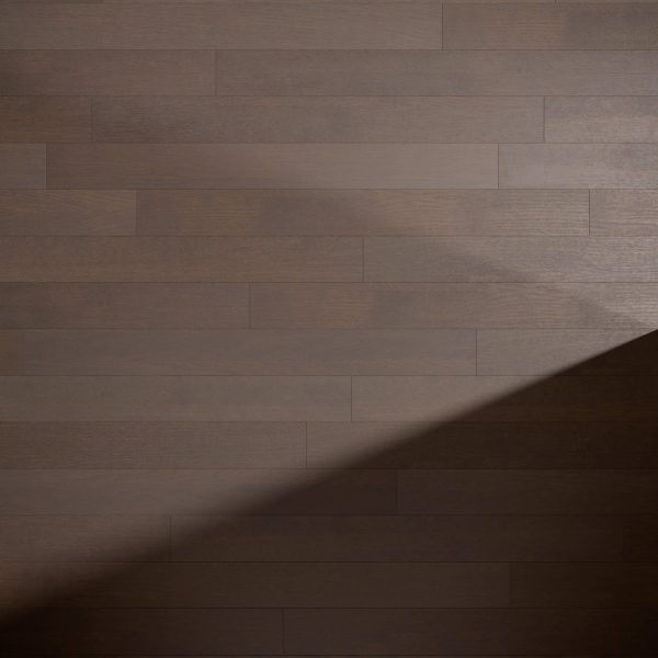 A section of smooth Bramble Oak* floorboards with a diagonal shadow in the lower right corner, highlighting the contrast between illuminated and shaded areas.