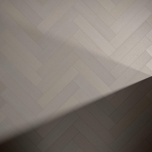 Castle Rock Oak* (Left) features a light wood herringbone pattern with a diagonal shadow cast across the surface.