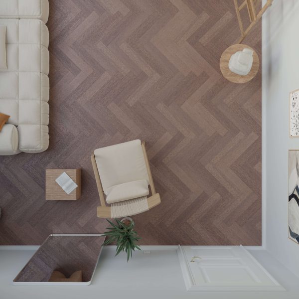 Top-down view of a modern living room featuring Hickory Americano* (Right) herringbone wood flooring, a beige sofa, wooden armchair, small table with a book, plant, and contemporary wall art.