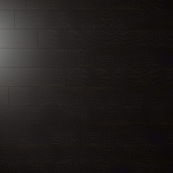 Modena Brown features a dark wooden floor with a subtle crocodile-skin texture, softly lit in the upper left corner and fading into shadow across the rest of the surface.